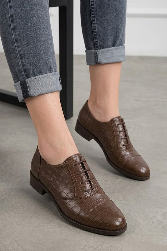 Women's dark brown classic oxfords and derby shoes with round toe and chunky rubber lug sole - Worn view
